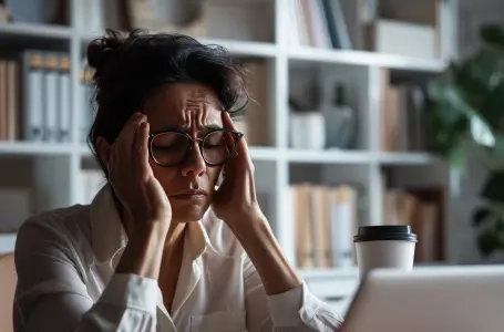 woman-business-attire-looking-stressed-fatigued-sitting-front-her-laptop-1