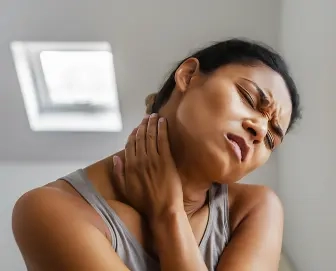 woman-with-hand-her-neck-1